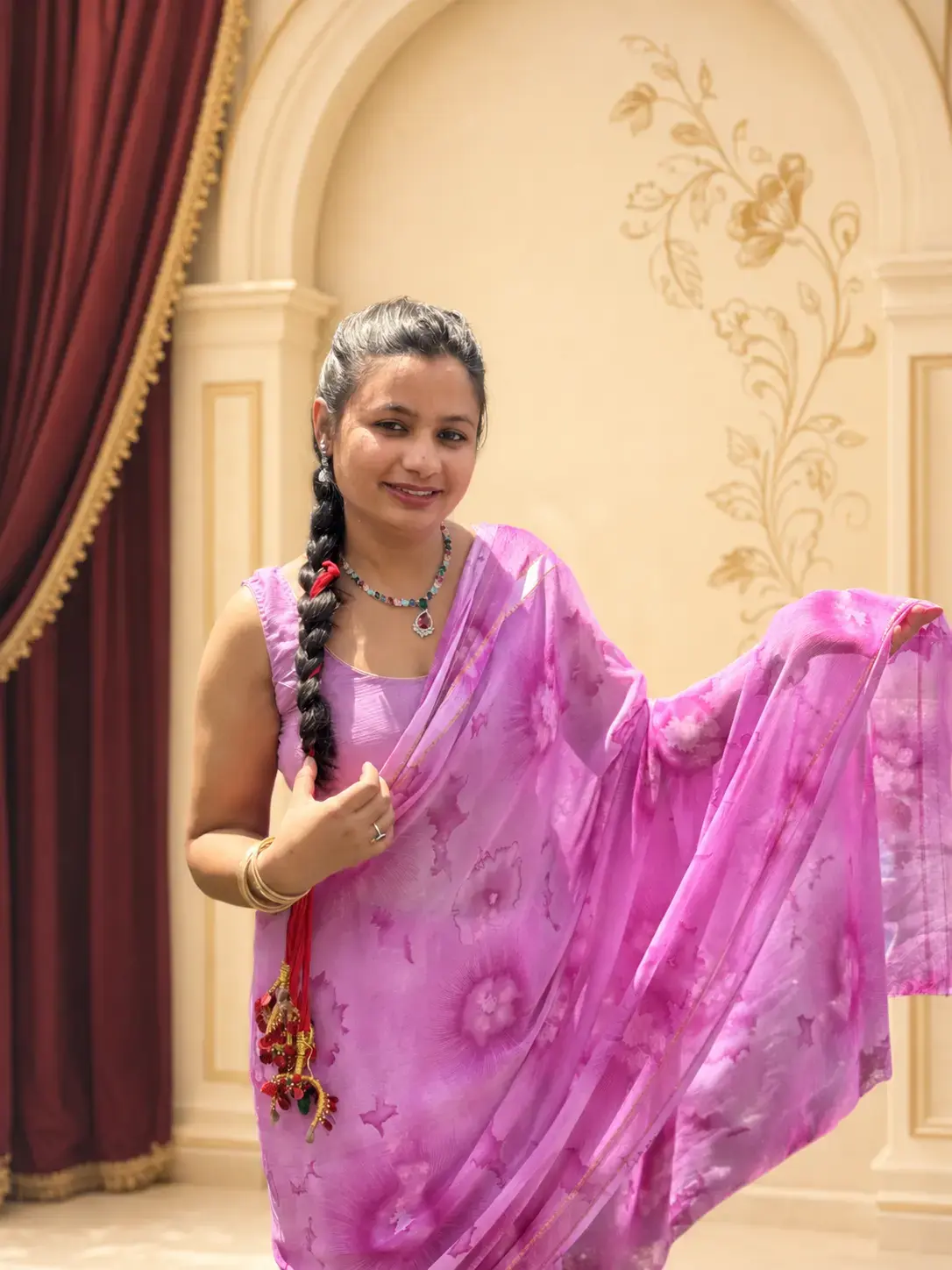 Nirmala Bastralaya saree model in a pink saree
